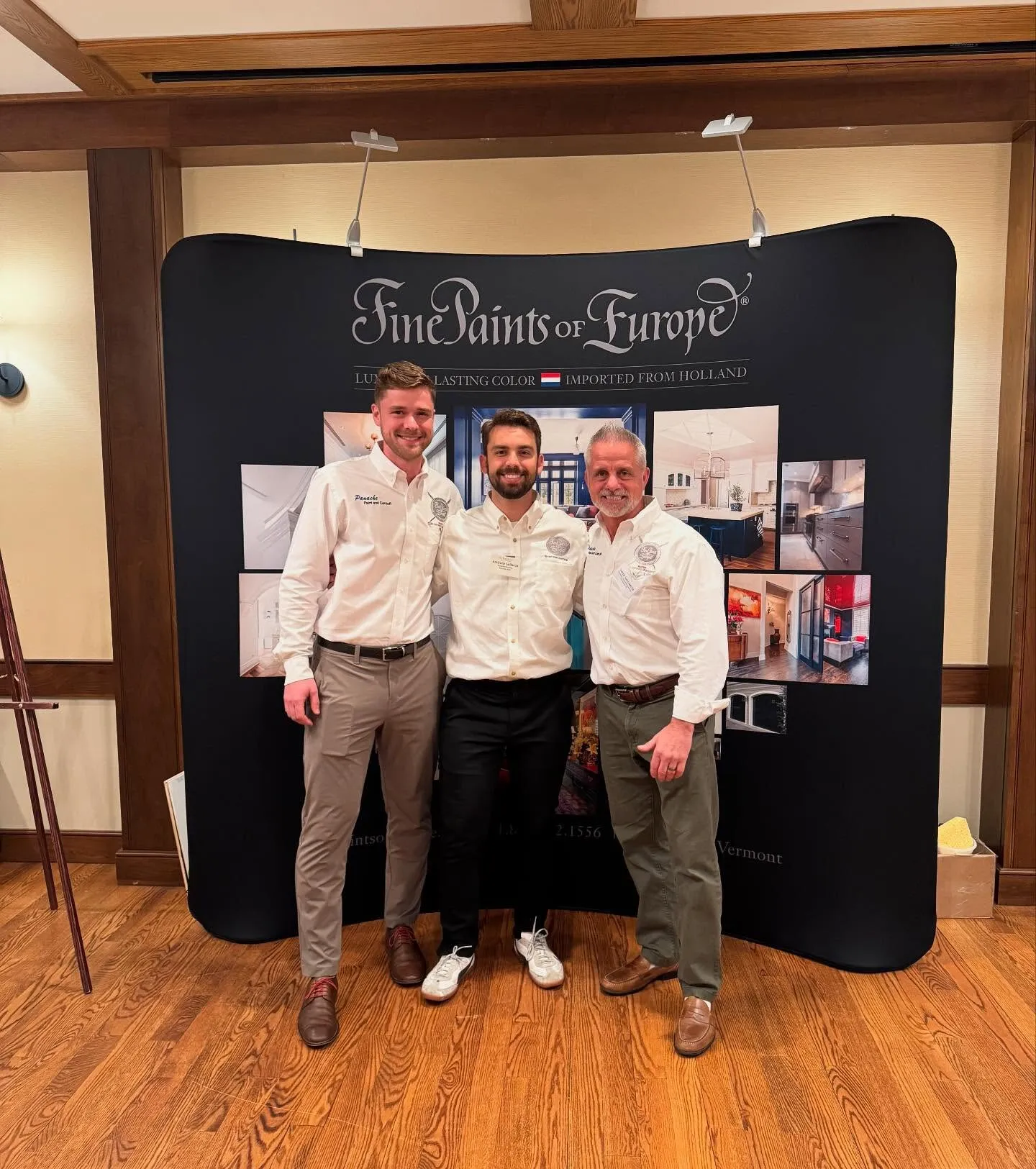 Tony and fellow painters at the Fine Paints of Europe booth