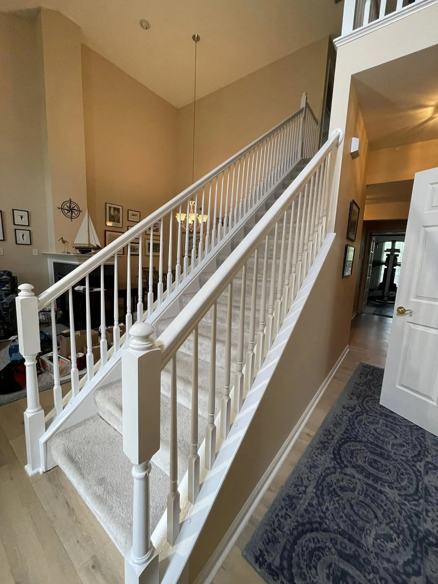 After: staircase railings and balusters painted clean white