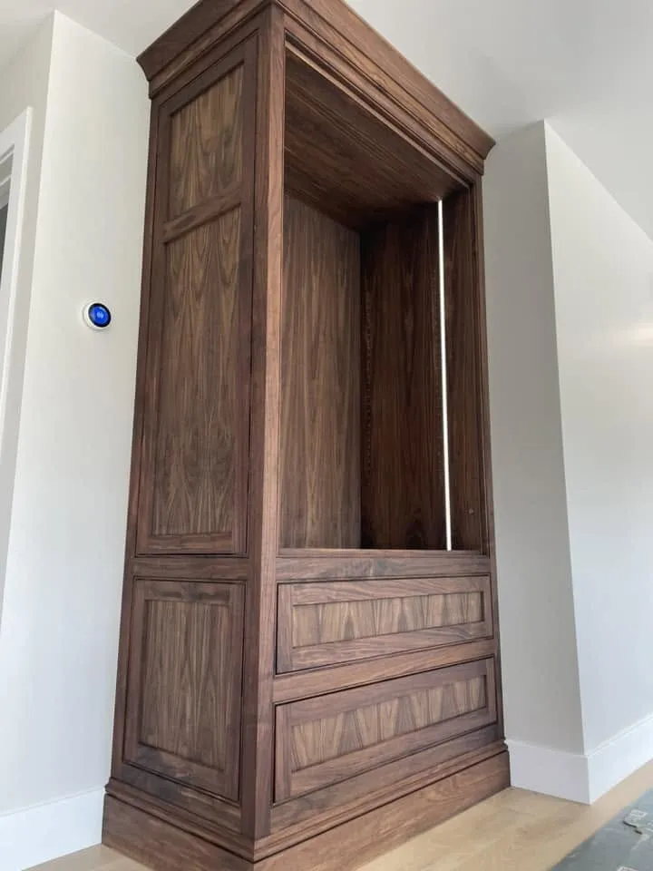 Tall walnut cabinet with a rich hand-applied stain finish